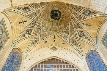 Persian dome ceiling brick and mosaic tiles pattern of a building near the Tomb of poet Hafez....