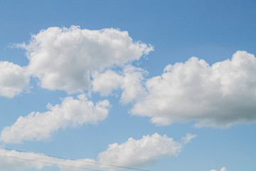 Naklejka na ściany i meble white clouds in the blue sky. background