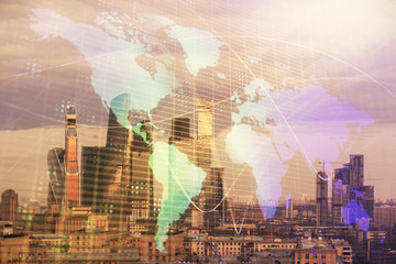 Fototapeta na wymiar Double exposure of world map on city veiw background. Concept of international trading