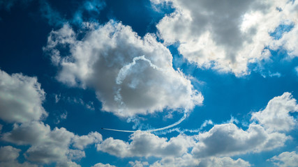 Naklejka na ściany i meble Airshow - heart symbol in the clouds