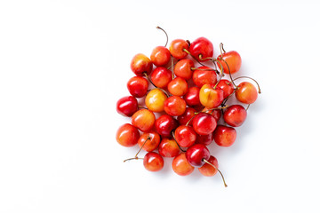 Top view image of fresh ripe red cherries in a circle isolated on white background