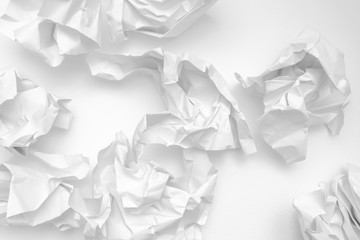 Obraz premium Modern crumpled white paper on empty sheet gray background with light shadows for creative wallpaper, card, art work design.