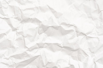 Modern crumpled white paper on empty sheet gray background with light shadows for creative wallpaper, card, art work design.