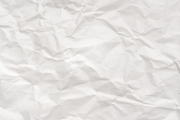 Obraz premium Modern crumpled white paper on empty sheet gray background with light shadows for creative wallpaper, card, art work design.