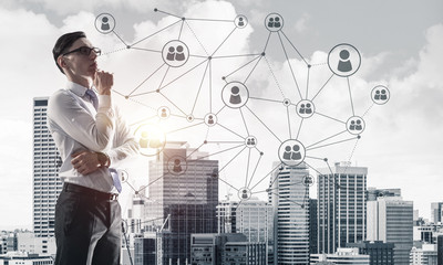 Concept of business success and control with confident boss against cityscape background