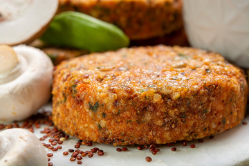 Tasty vegetarian and vegan burgers made from healthy quinoa, basil, tomatoes and champignon mushrooms