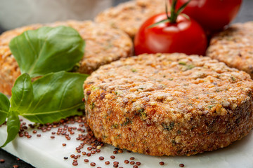Tasty vegetarian burgers made from healthy quinoa, basil, tomatoes and mozzarella cheese