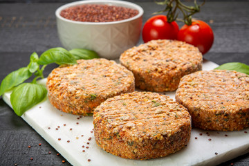 Tasty vegetarian burgers made from healthy quinoa, basil, tomatoes and mozzarella cheese