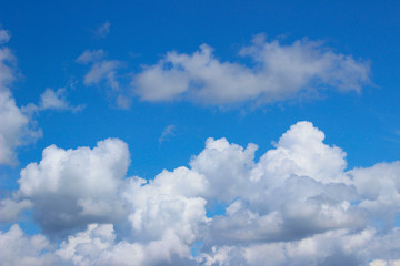 Naklejka na ściany i meble Blue sky and white clouds. Beautiful nature background. Freedom, nature concept.