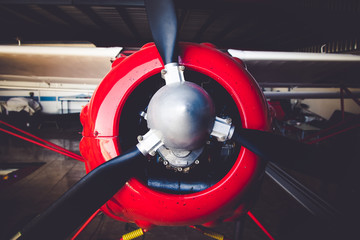 A red red vintage old engine airplane close up