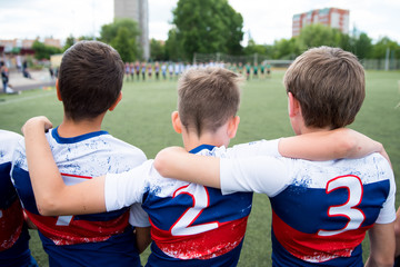Football team boys support each other