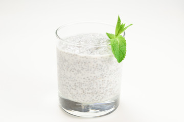 Chia pudding with mint on a white background. Space for text or design.