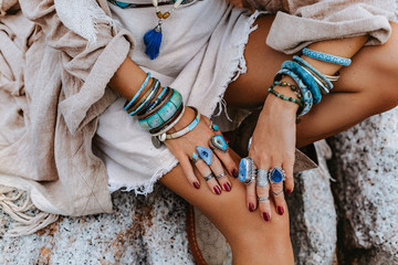 close up of young woman with lot of boho accessories outdoors - obrazy, fototapety, plakaty