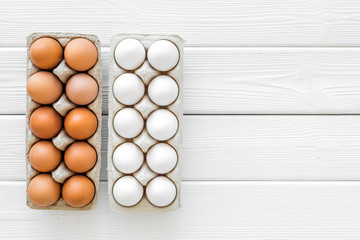Fresh eggs for organic food on white wooden background top view mockup