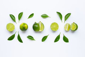 Fresh limes with leaves isolated on white