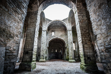 Fototapeta premium Old scandinavian abandoned ancient castle with high stone material walls
