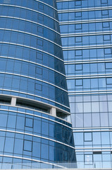 Fototapeta na wymiar office building with blue glass facade