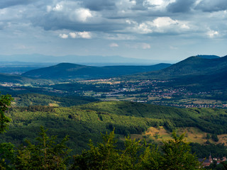 Obraz premium Spacious mountain landscape. A view from the mountain to the valley of Rhine and the village of Alsace.