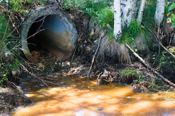Pollution of sewage. Pollution of nature with toxic chemicals from the pipe. Ecological problems, ecological disaster.
