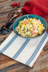 Homemade Chinese fried rice with vegetables and fried eggs