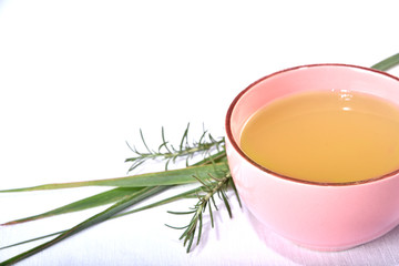 green tea with lemon balm and rosemary on white background