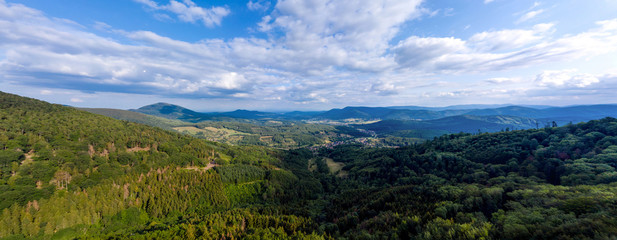Fototapeta na wymiar Spacious mountain landscape. A view from the hill to the valley of Alsace.