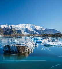 Icebergs in Jokulsarlon glacier lagoon, Iceland - obrazy, fototapety, plakaty