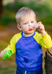 portrait of little BOY outdoors in summer