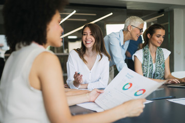 Group of successful business people at work in office