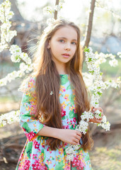 portrait of little girl outdoors in summer
