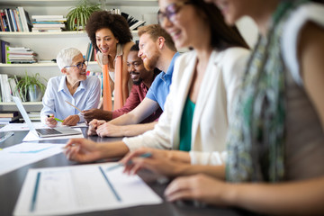 Group of successful business people at work in office