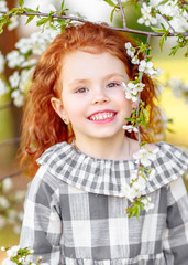 portrait of little girl outdoors in summer