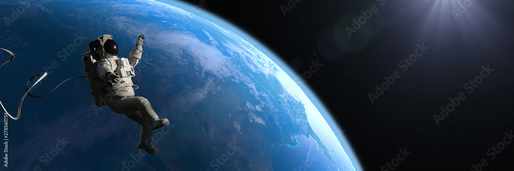 Canvas Prints astronaut hovering in orbit of planet earth