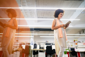 Professional business woman in motion with blur in business office