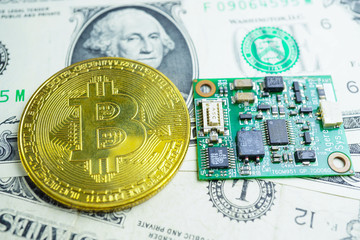 A golden bitcoin on circuit and US dollar banknotes background. Finance Electronic Technology...