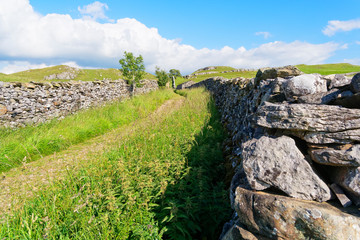Following the Pennine Bridleway over the Yorkshire Dales on a summer afternoon.