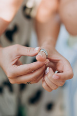 the girl wears a ring on her finger