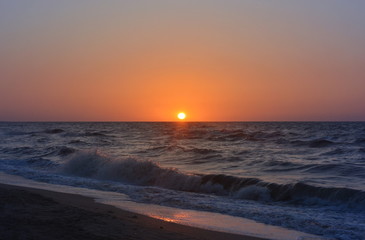 Fototapeta premium Sunset on the sea with cloudless sky