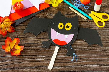 Dracola bat toy Halloween on a wooden table. Children's art project, craft for children. Craft for...