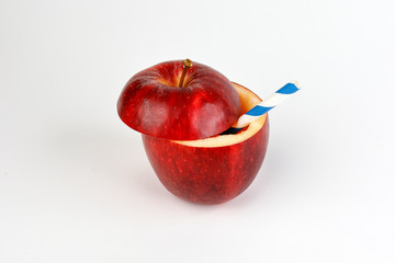 Health Red Cut Apple recyclable paper straw juice drink idea concept on white background