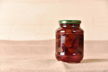 Homemade preserves on a rustic background