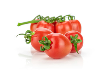Lot of whole fresh red tomato cherry isolated on white background
