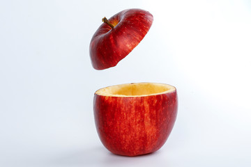 Health Red Cut Apple floating top slice juice drink idea concept on white background