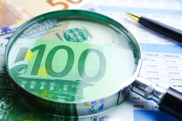 Magnifying glass on charts graphs spreadsheet paper. Financial development, Banking Account, Statistics, Investment Analytic research data economy, Stock exchange trading, Business office company meet