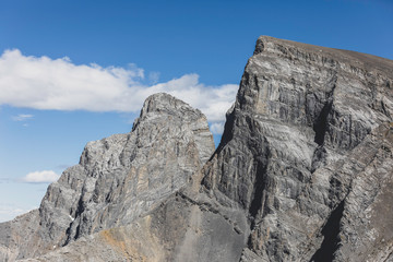 Fototapeta premium Close-up of the Big and Middle Sister of the Three Sisters Peaks. This mountainous formation is located in Rocky Mountains and it can be seen from almost any location in Canmore, Alberta, Canada