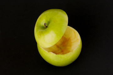 Healthy Green Cut Apple floating top slice juice drink idea concept on black background