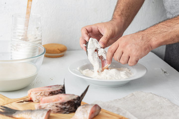 Man prepares carp river fish. Cooking healthy and diet food