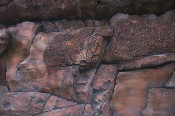 texture of wild stone with moss and vegetation, abstract texture of natural solid minerals