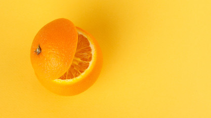 Healthy Orange Cut floating top slice juice drink idea concept on yellow background