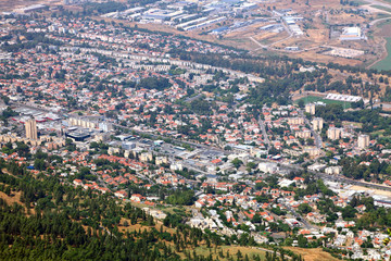 Fototapeta premium Spring amazing view from top of Manara Cliff on Kiryat Shmona city, colorful agricultural valley and Golan Heights. North of Israel 